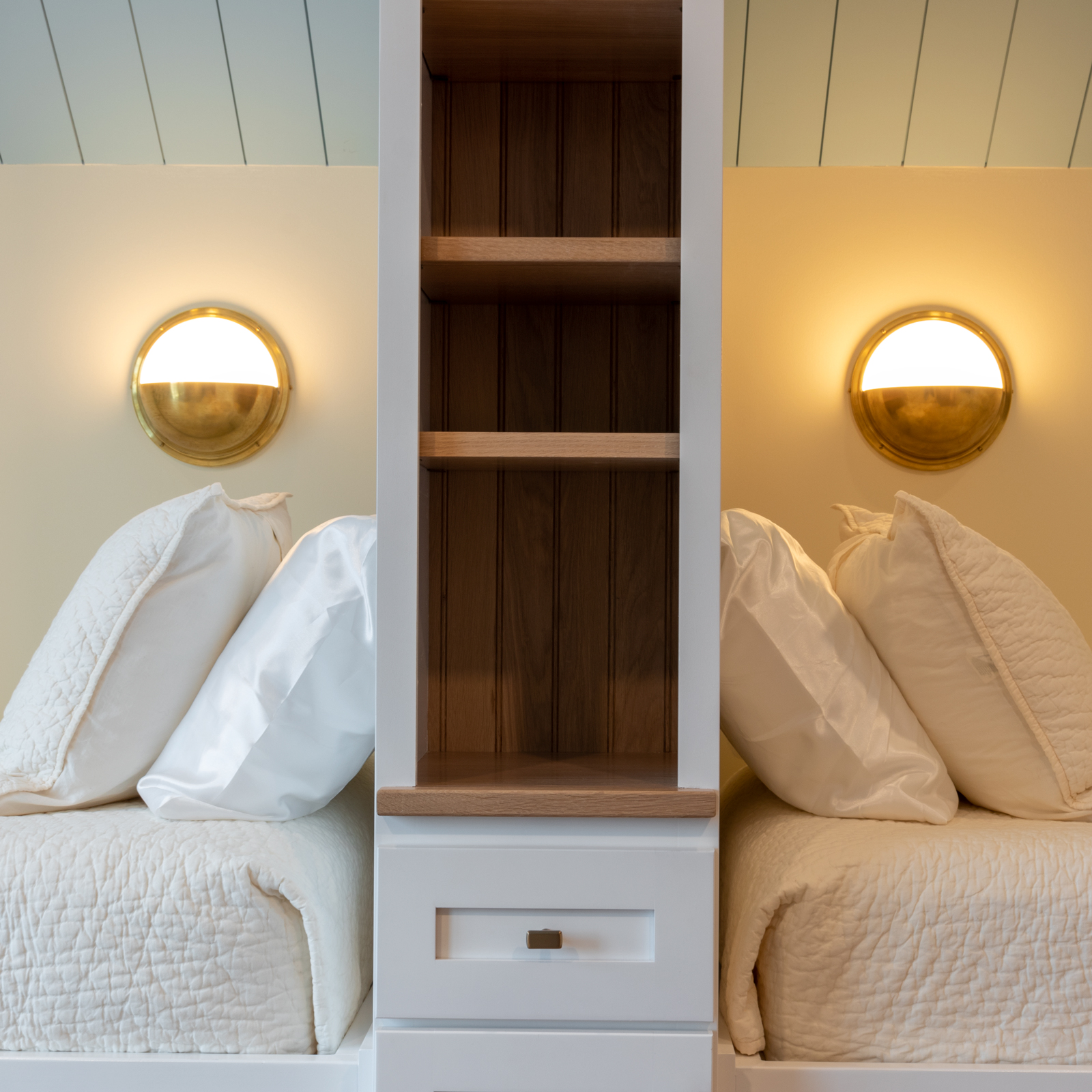 Prioritizing lakeside views, the bunkroom is designed to sleep six with pull-out trundle beds that can be hidden away when guests have gone home.