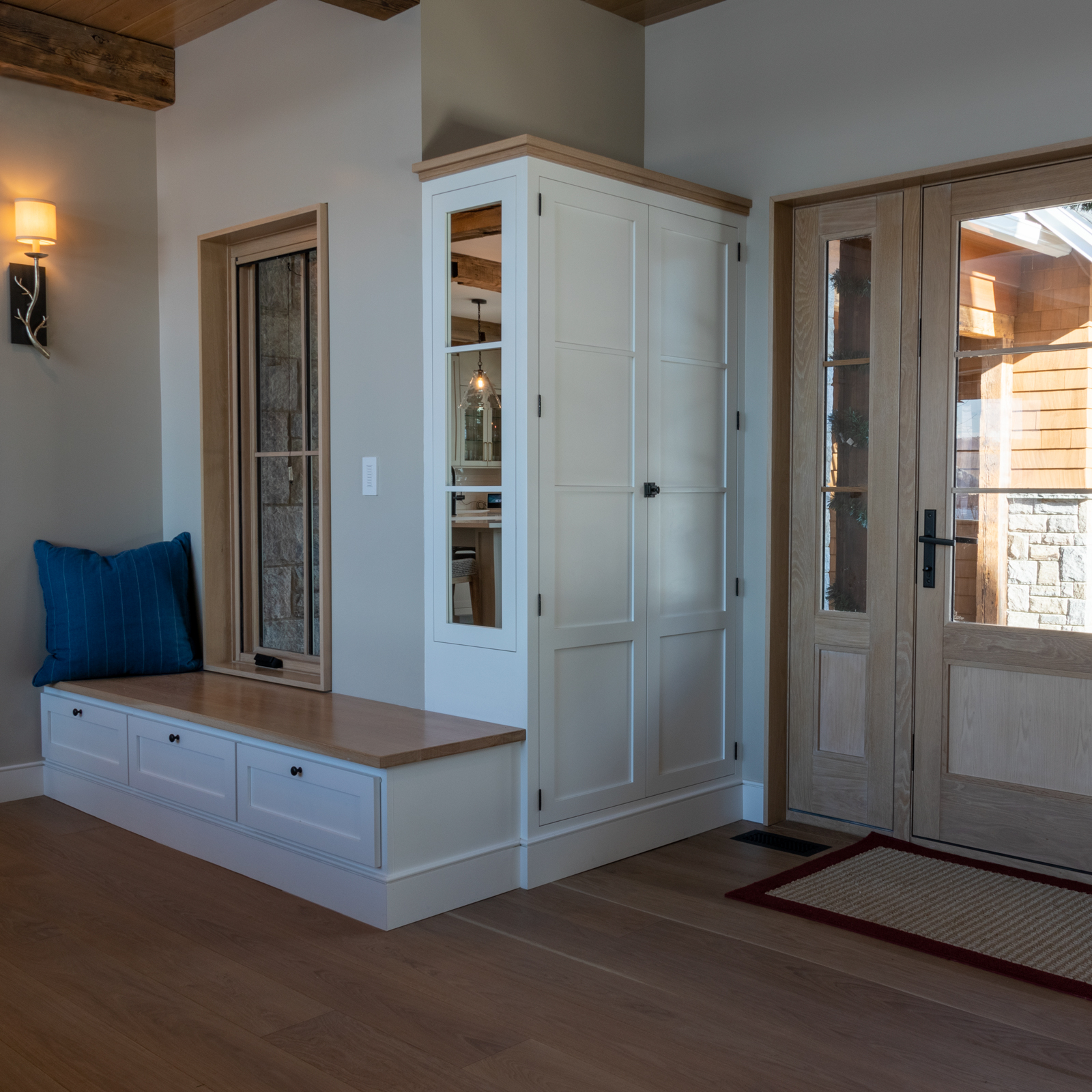 The custom-entry built-in closets are perfect for storing not just coats, but also other accessories in the bench drawers. 