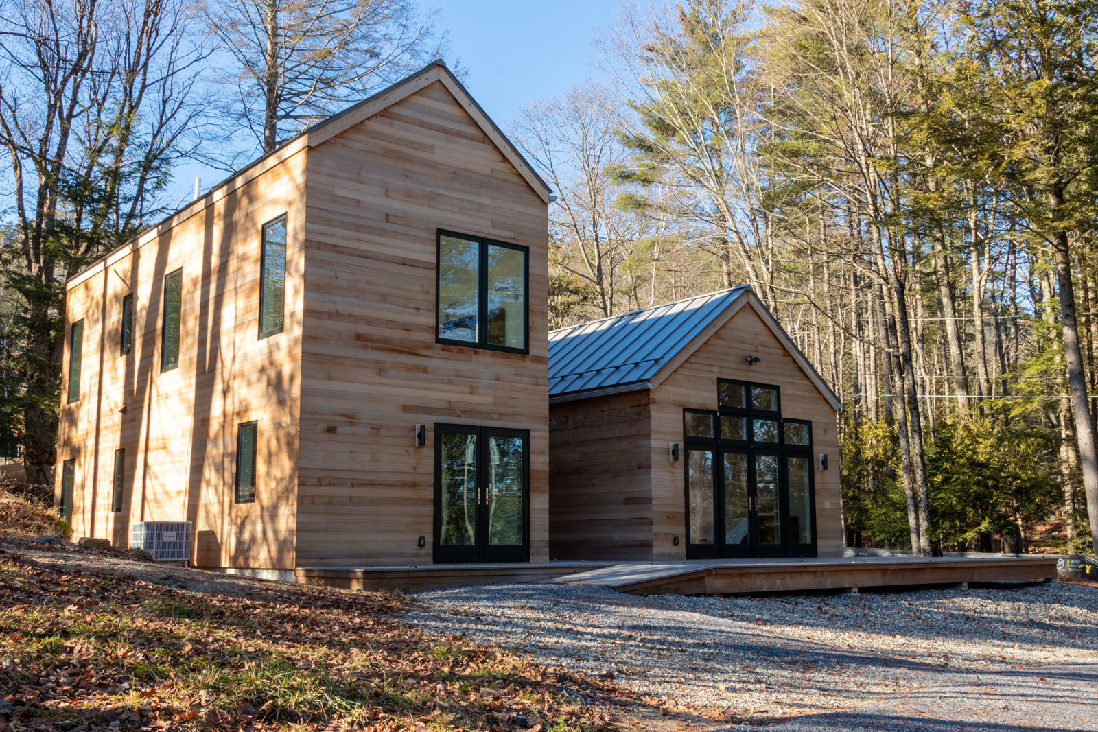 This Lake George guest cottage is sided with a western red cedar. It has a warm tone that glows with the reflection of light passing through the trees. As it ages it will turn to a stone grey that will reflect the colors of the bedrock that stretches through the earth. 