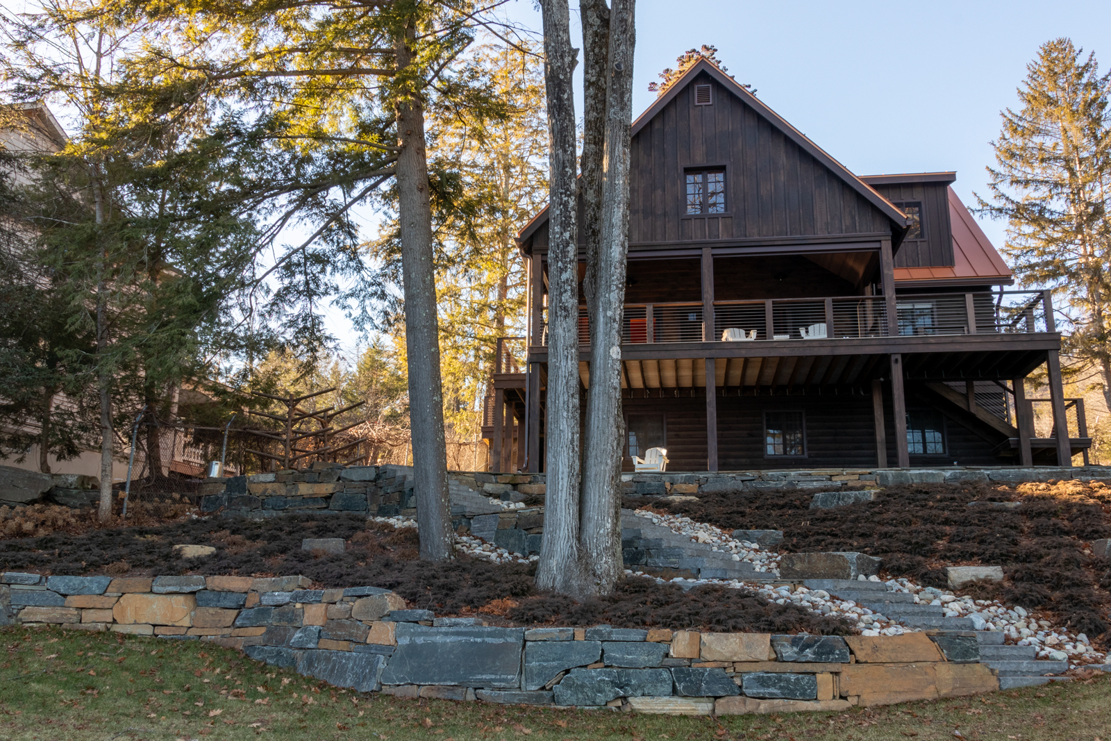 AJA crafted an expansive covered deck area capable of hosting the entire family. Included in the renovations was new landscaping with beautiful locally sourced stone.  